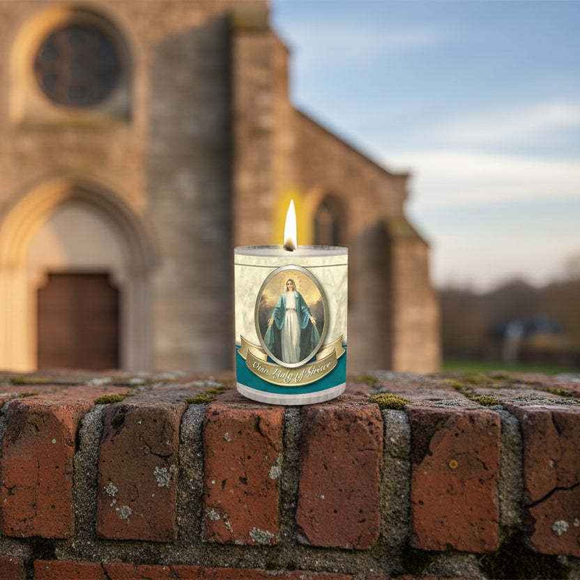 Candle with a religious design featuring OUR LADY OF GRACE