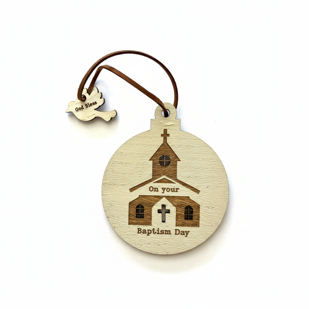 A wooden baptism decoration featuring an engraved church with a cross, and the text 'On your Baptism Day'. There is a small heart with the name 'Sue Anne' engraved on it, and the piece is attached to a brown string.