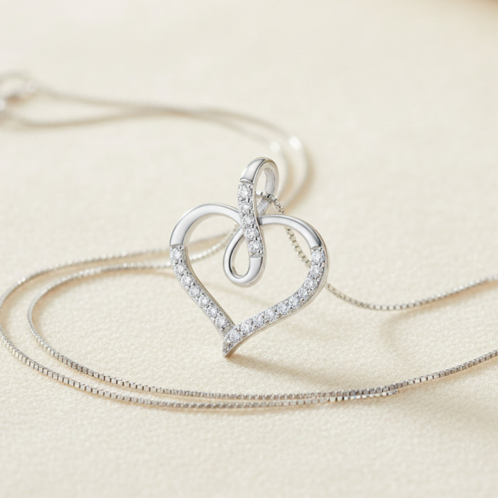 Heart-shaped pendant with a small chain on a white background