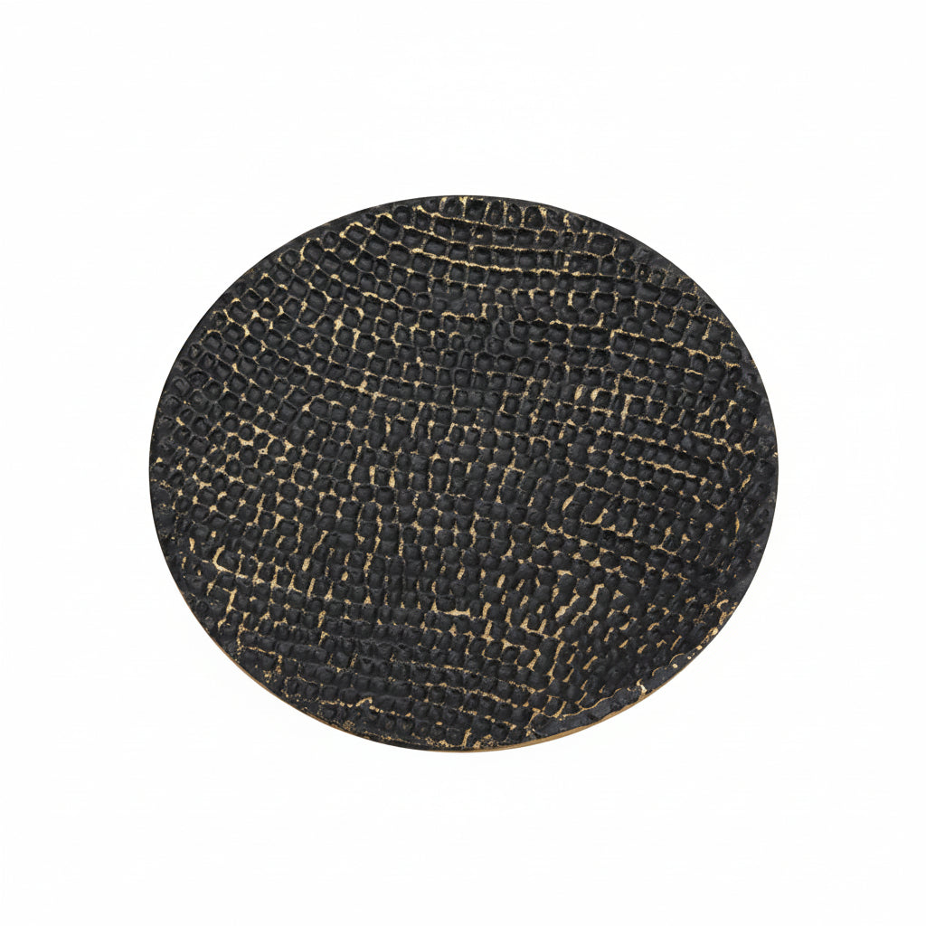 Round black textured mat with a gold border on a white background