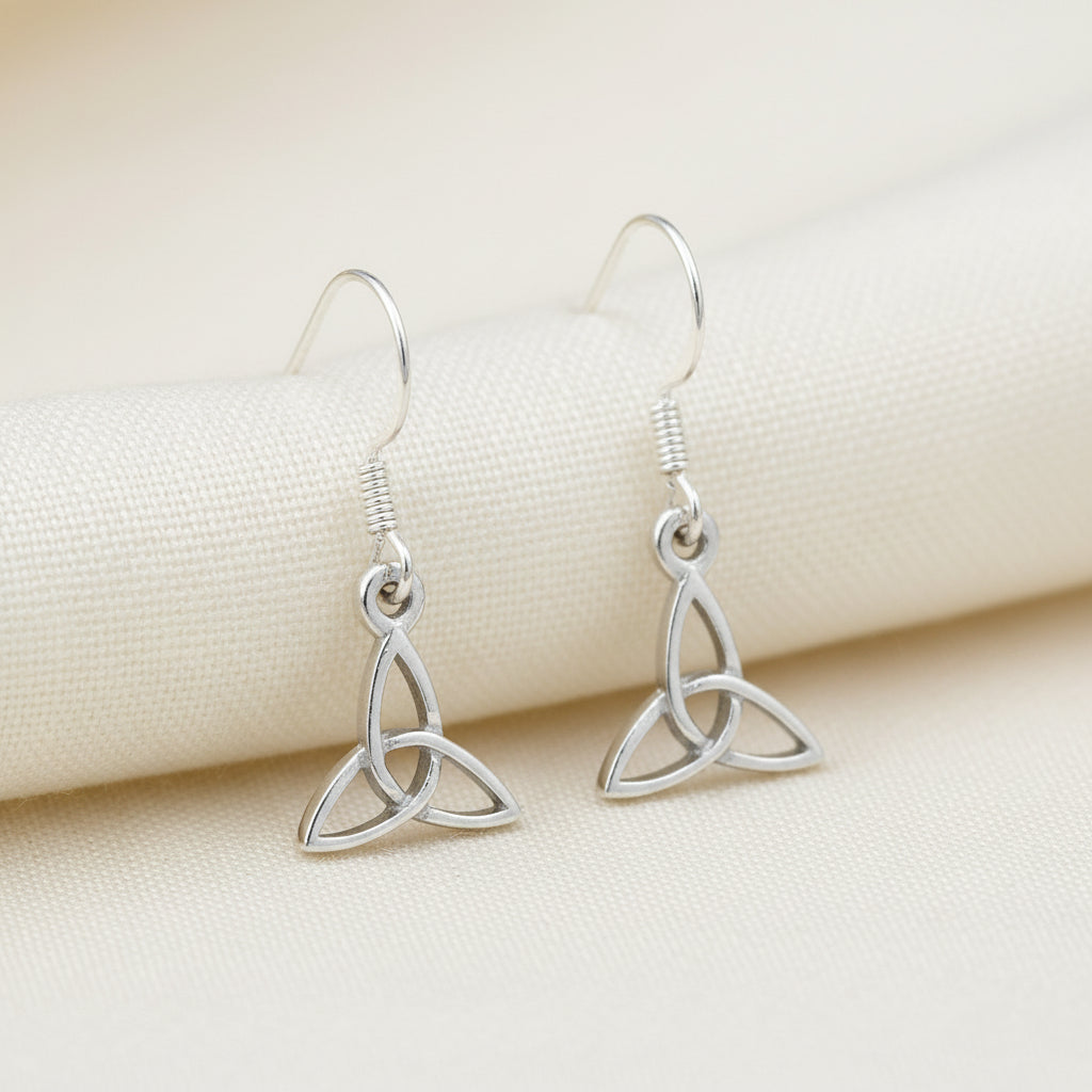 Silver Trinity knot earrings on a white background