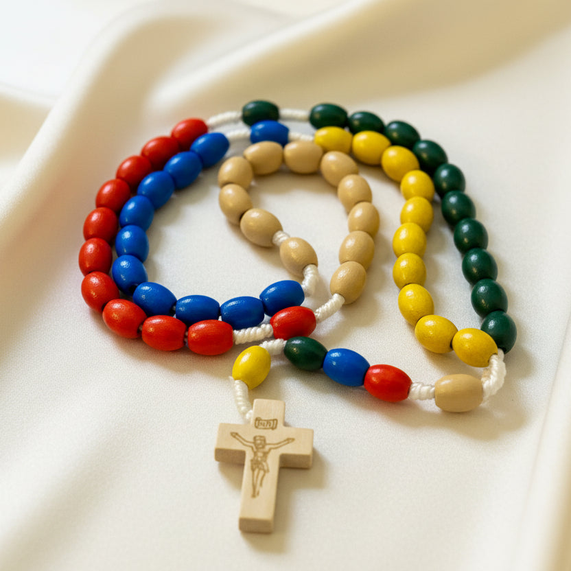 Colorful rosary with a gold cross on a white background