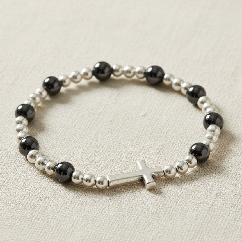 Glass bracelet with cross charm on a 'Inspirations' branded card