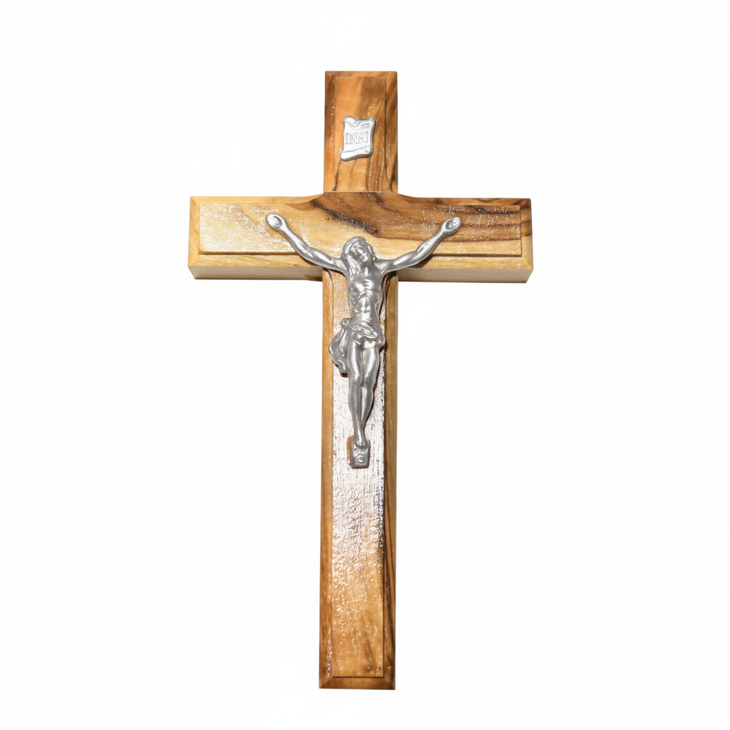 A wall-mounted crucifix with a wooden cross and a metal representation of Jesus Christ in silver tone.