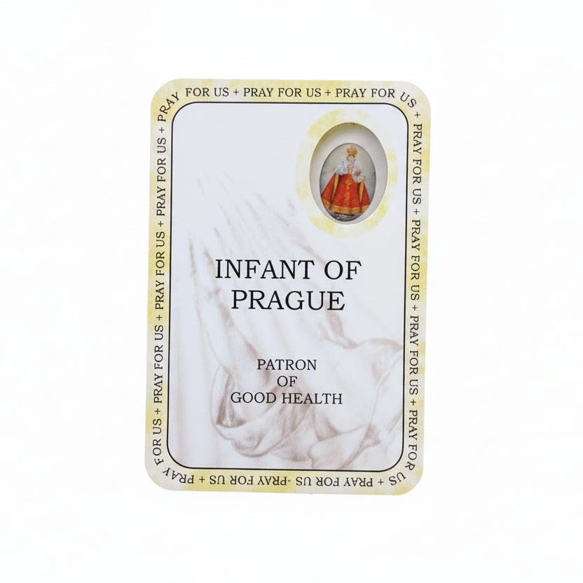 Card featuring 'Infant of Prague' on a wooden surface