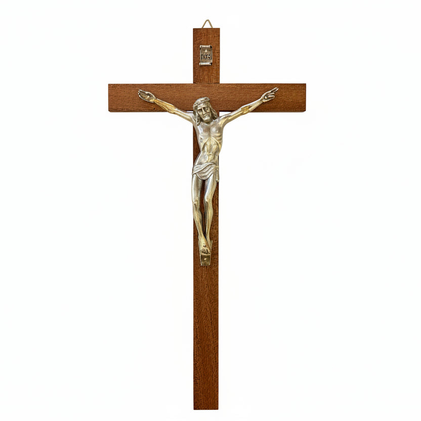 A vertical wooden crucifix with a metal representation of the crucified Christ, designed for wall hanging.