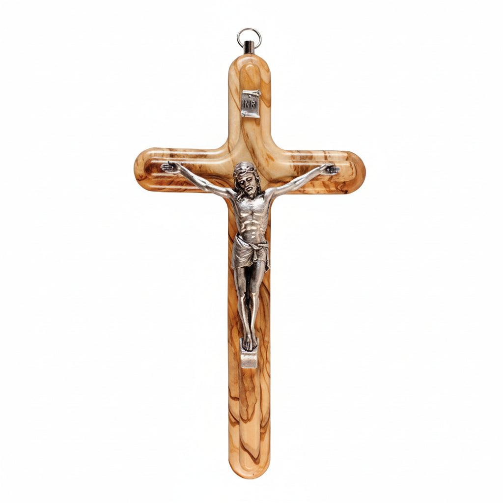 Wooden crucifix with silver Jesus figure on a white background