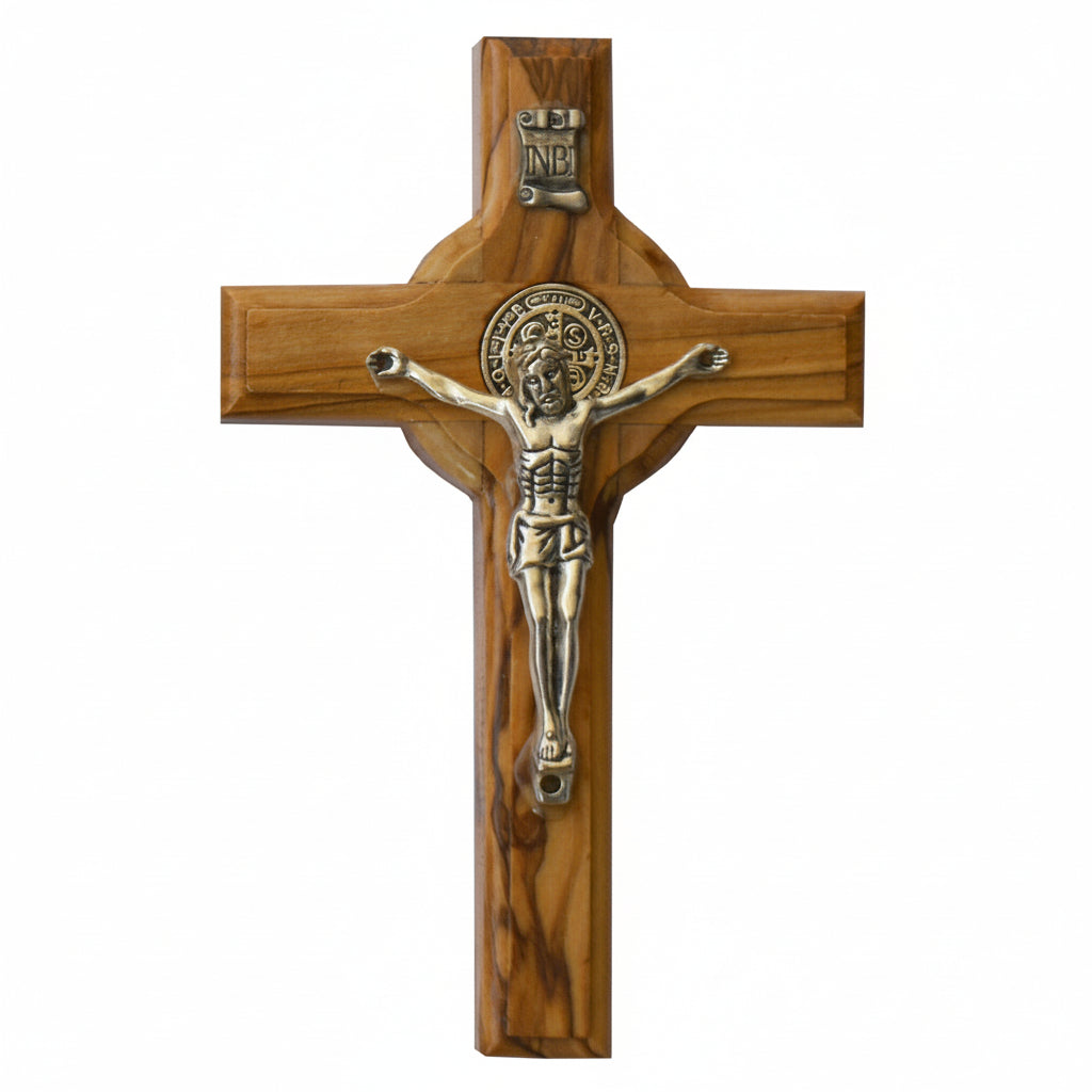 Wooden cross with a metal figure of Jesus on a white background
