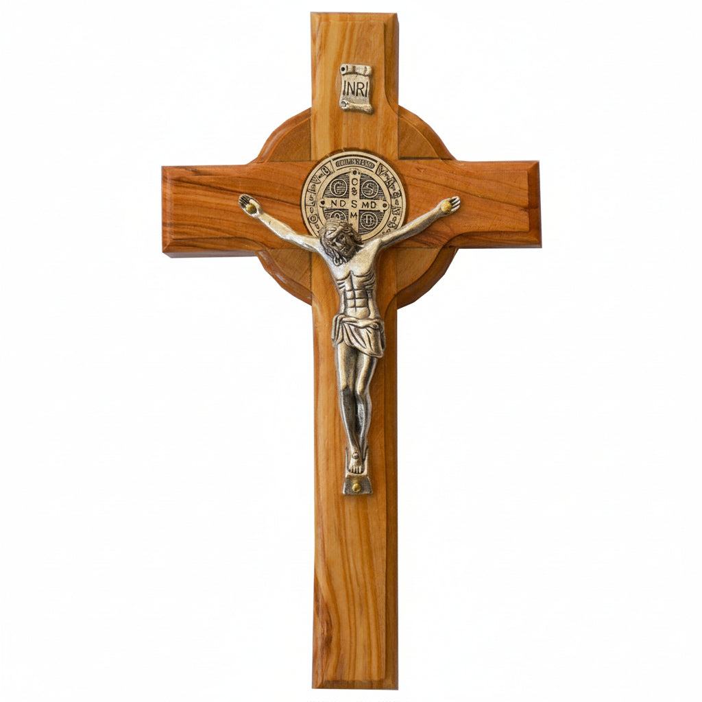 Wooden cross with a metal figure of Jesus on a white background