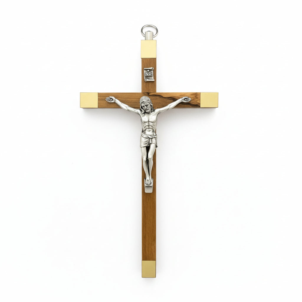 A wooden crucifix with a sterling silver corpus, designed for hanging.