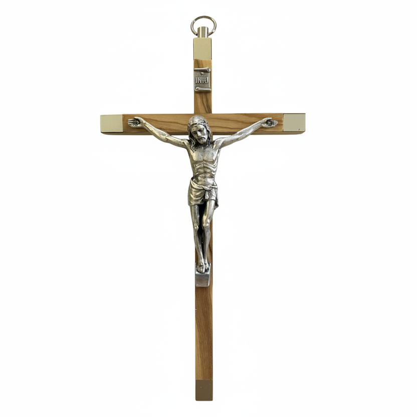 A silver crucifix with a wooden cross, featuring the figure of Jesus Christ.