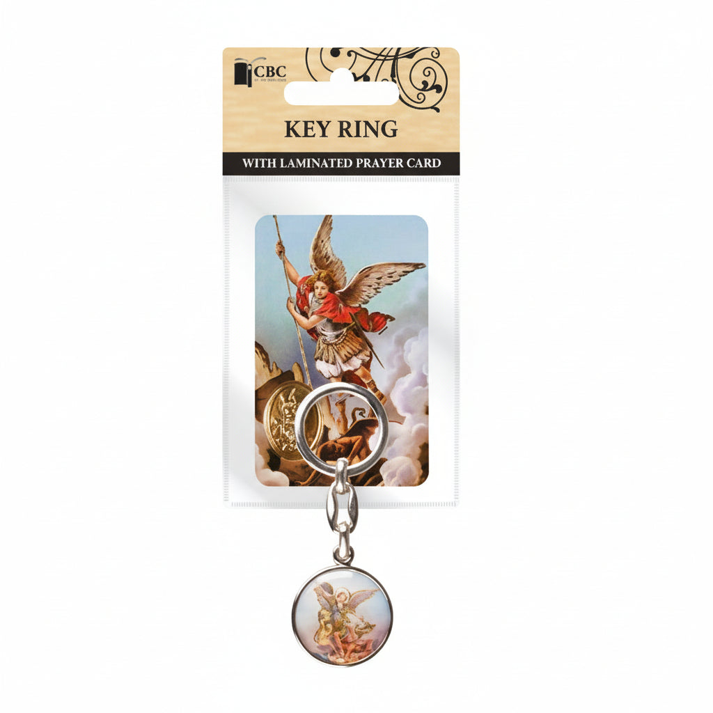 Key ring with angel design on packaging against a light gray background