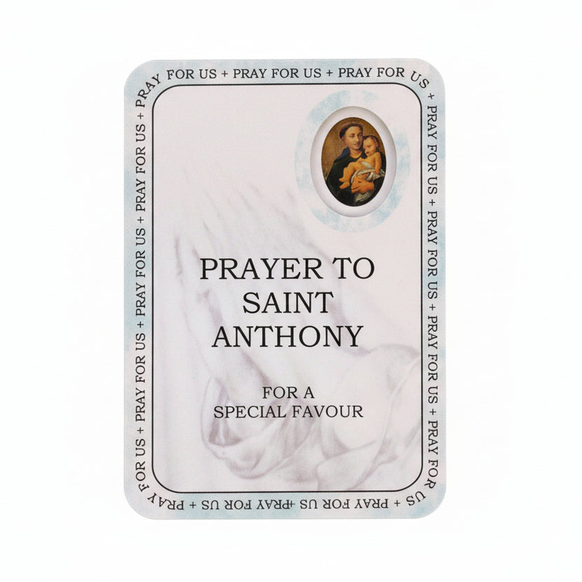 Prayer card to Saint Anthony on a wooden surface