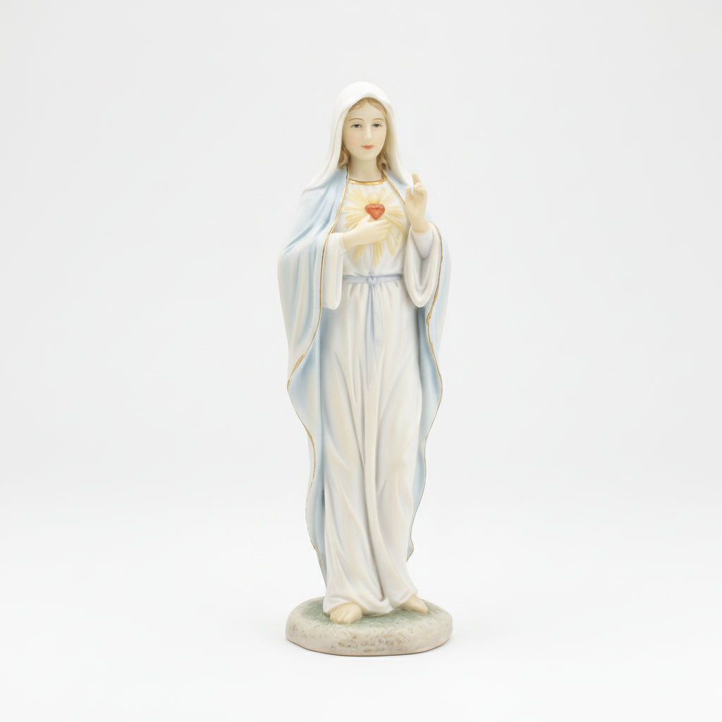 Statue of a religious figure in a white robe with a heart symbol on a white background