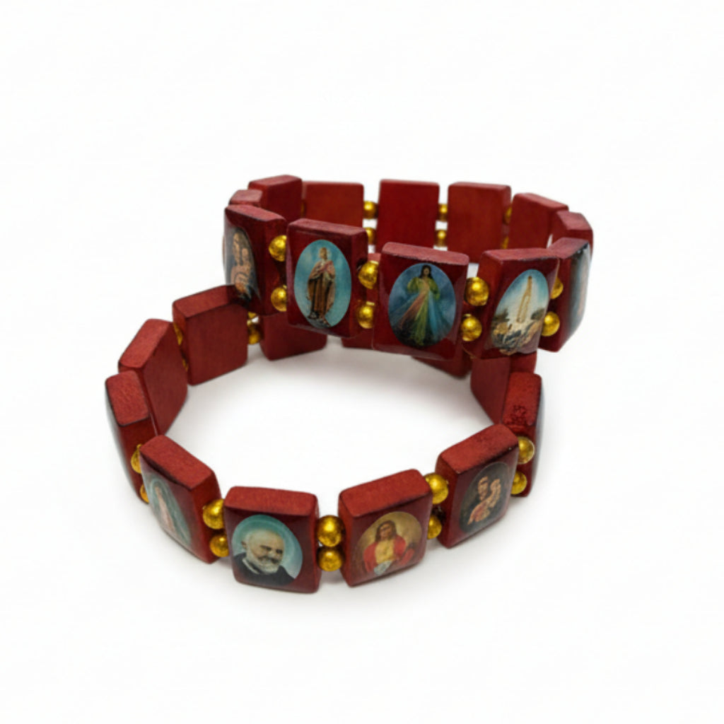 Wooden bracelet with religious icons on a white surface
