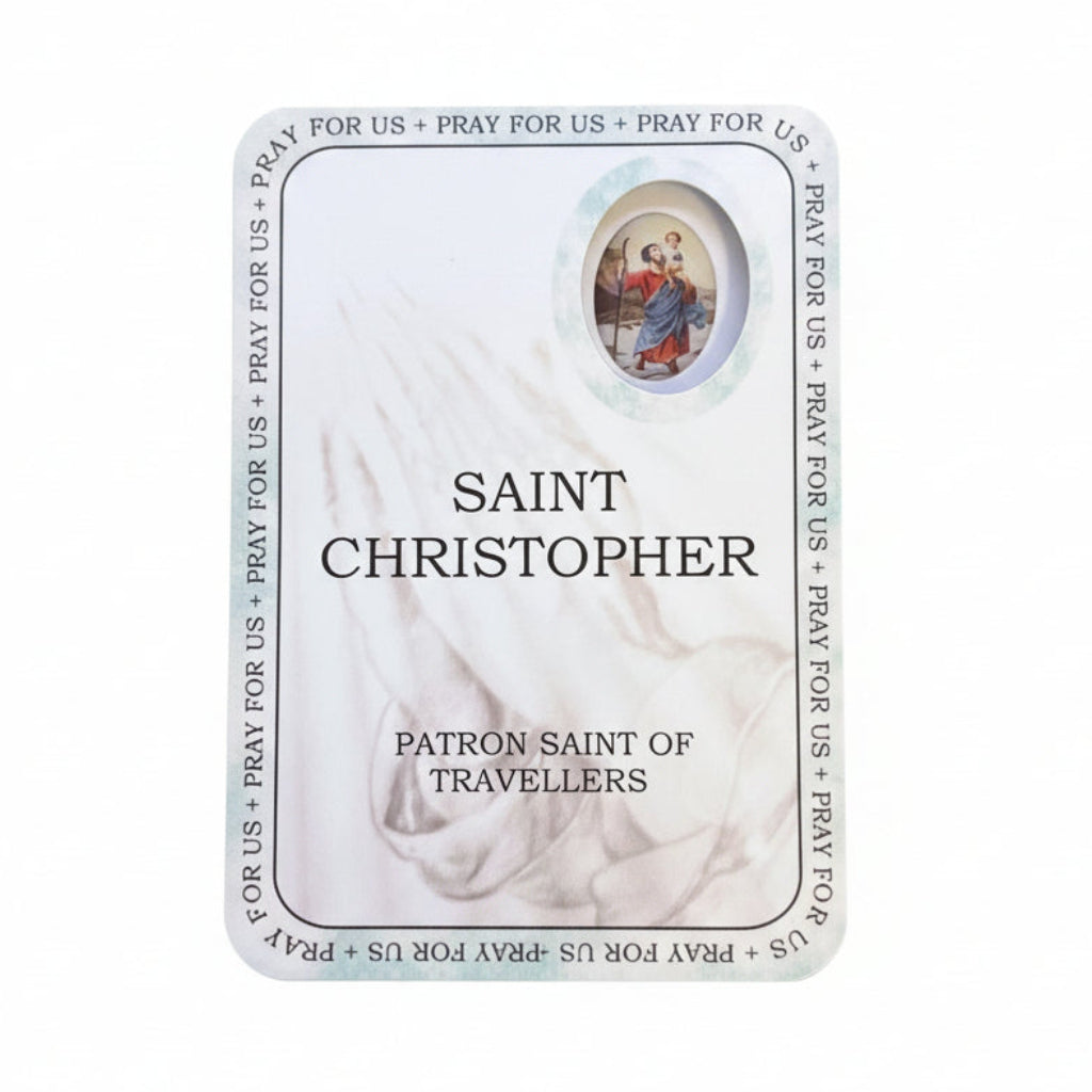 Card featuring Saint Christopher on a wooden surface