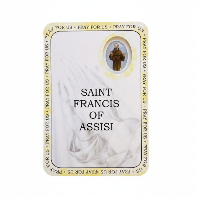 Card featuring Saint Francis of Assisi on a wooden surface