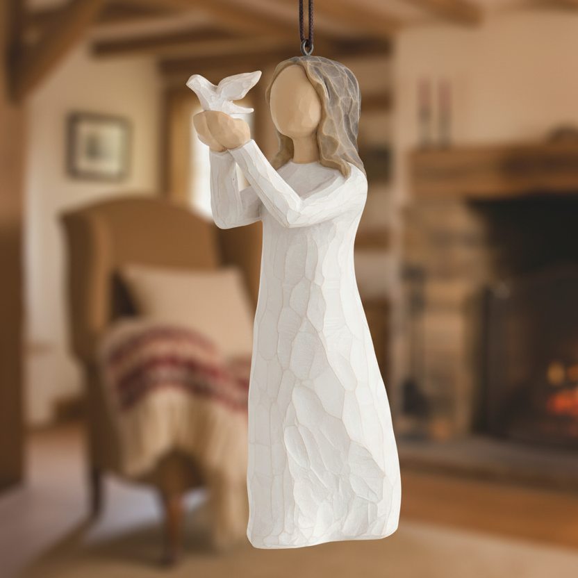 Decorative figurine of a woman holding a dove against a white background