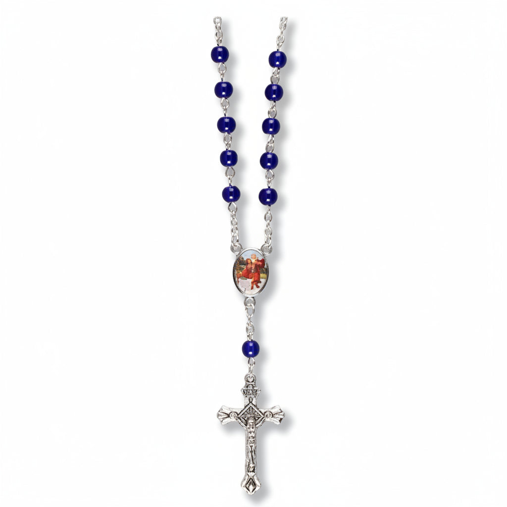 A single decade car rosary with blue glass beads and a silver clasp, packaged with a header card.