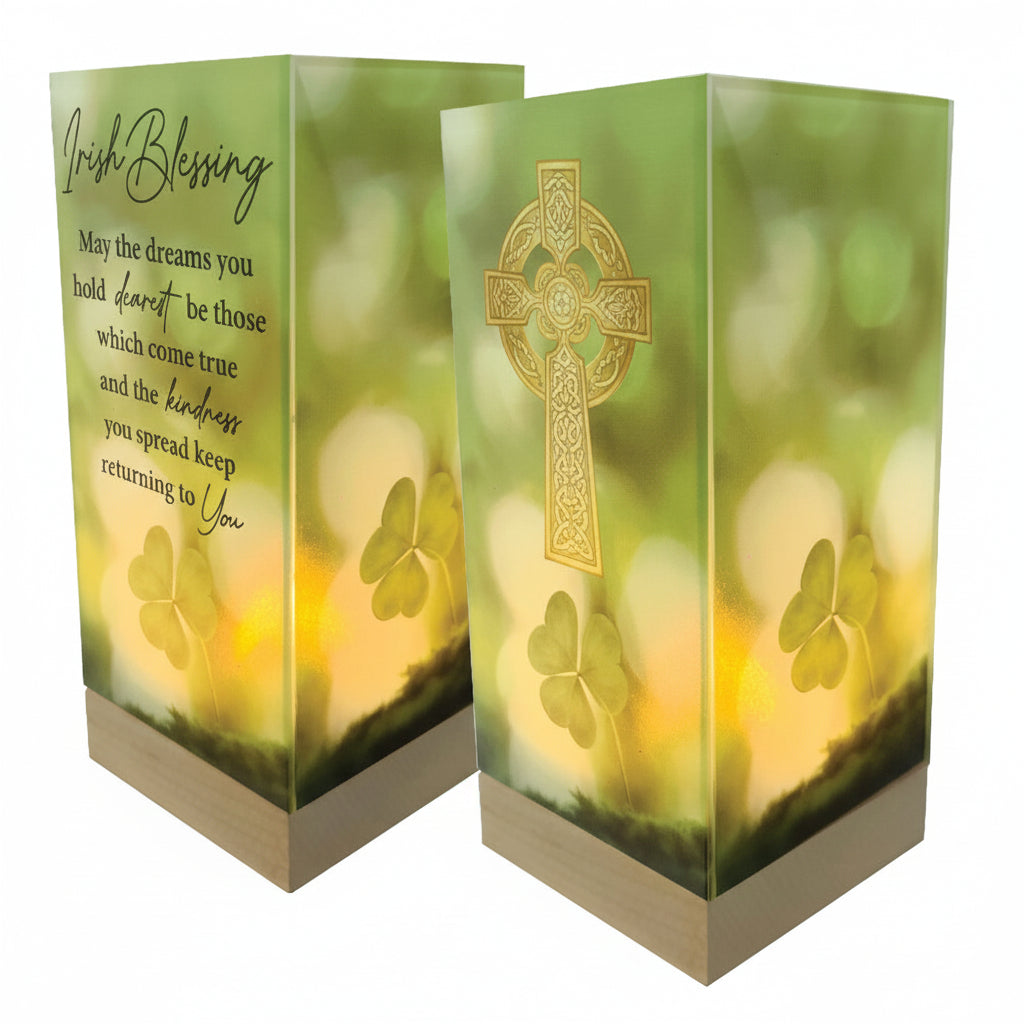 Decorative lantern with Celtic cross design and shamrock symbols on a green background.