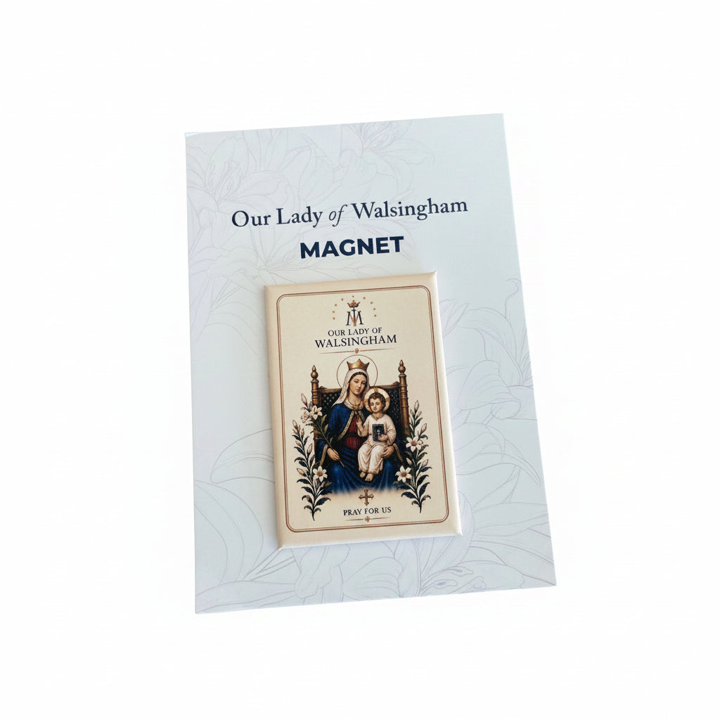 A small Our Lady of Walsingham devotional magnet displayed on a white backing card, placed on a brown stone surface. The card reads 'Our Lady of Walsingham MAGNET' and shows the printed religious artwork on the magnet.