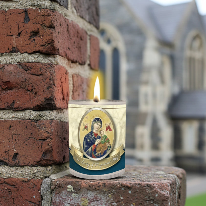 Candle with an icon of a religious figure on a blue background