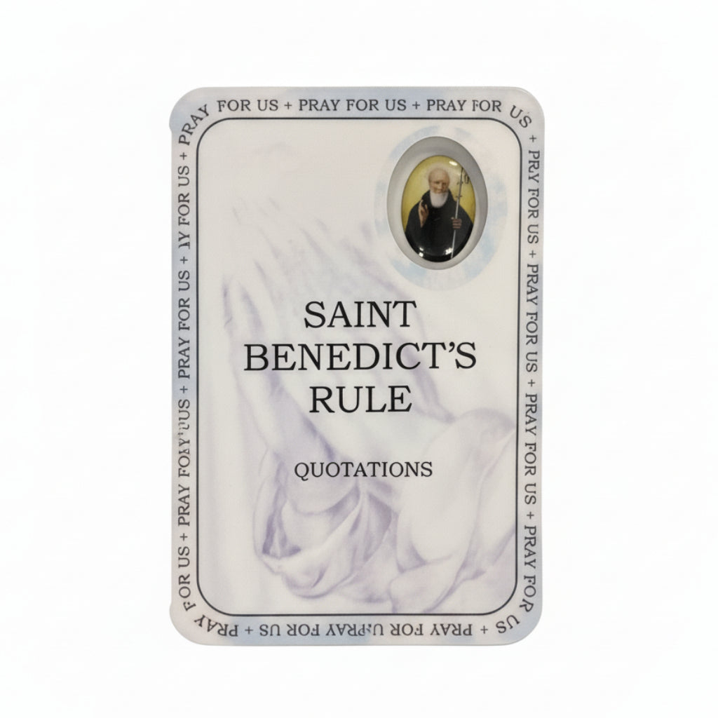 Card with 'Saint Benedict's Rule' on a wooden surface
