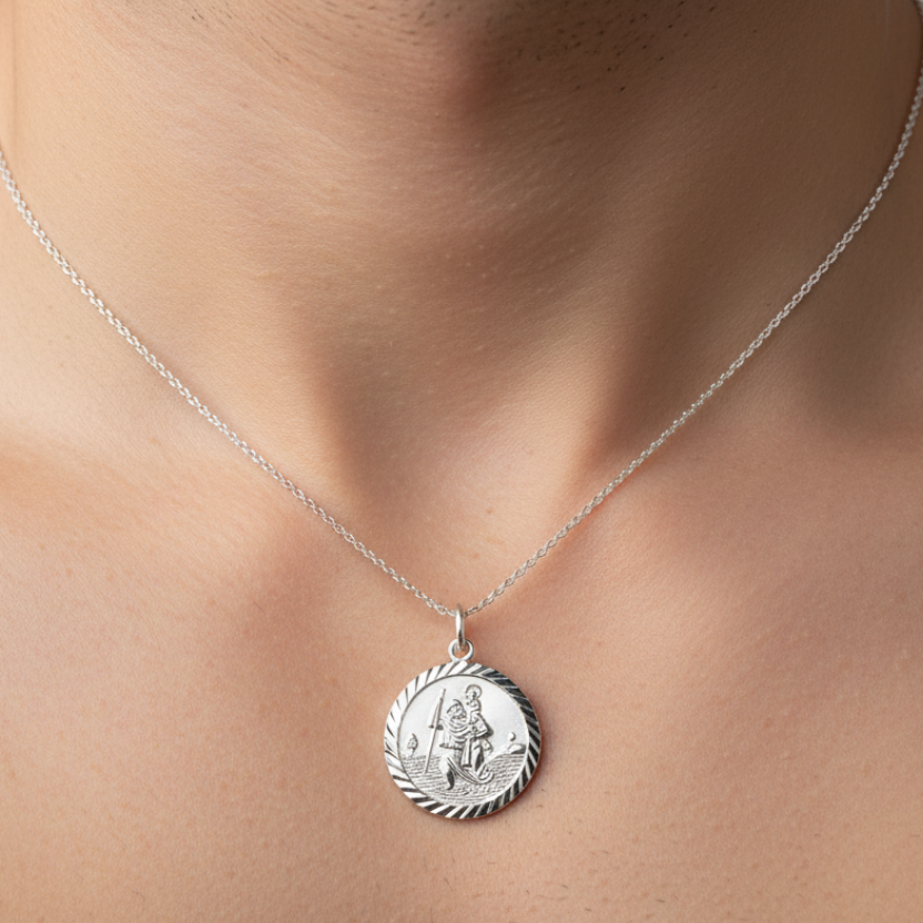 Silver pendant necklace on a light gray background