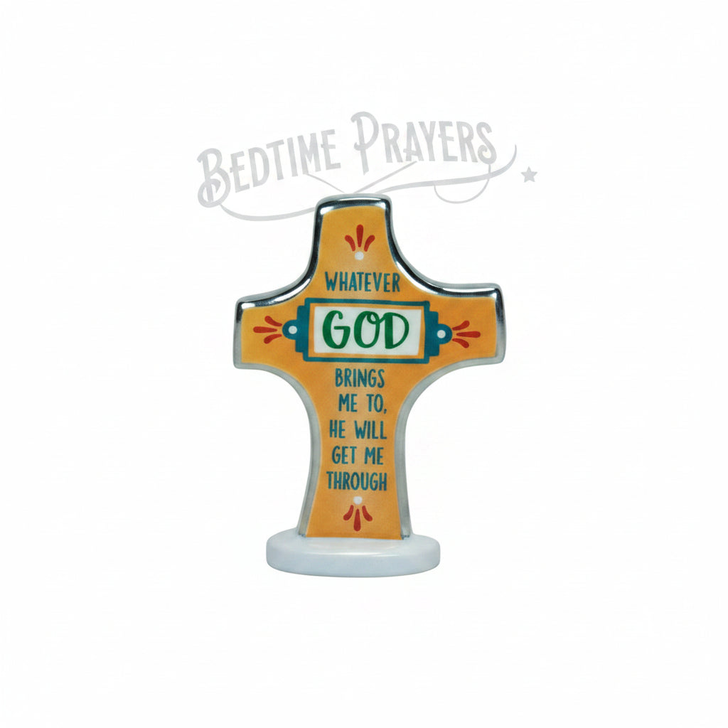 A decorative cross-shaped candle or ornament labeled 'BEDTIME PRAYERS' with a central 'GOD' panel and printed prayer text, shown on a kraft paper backing card.