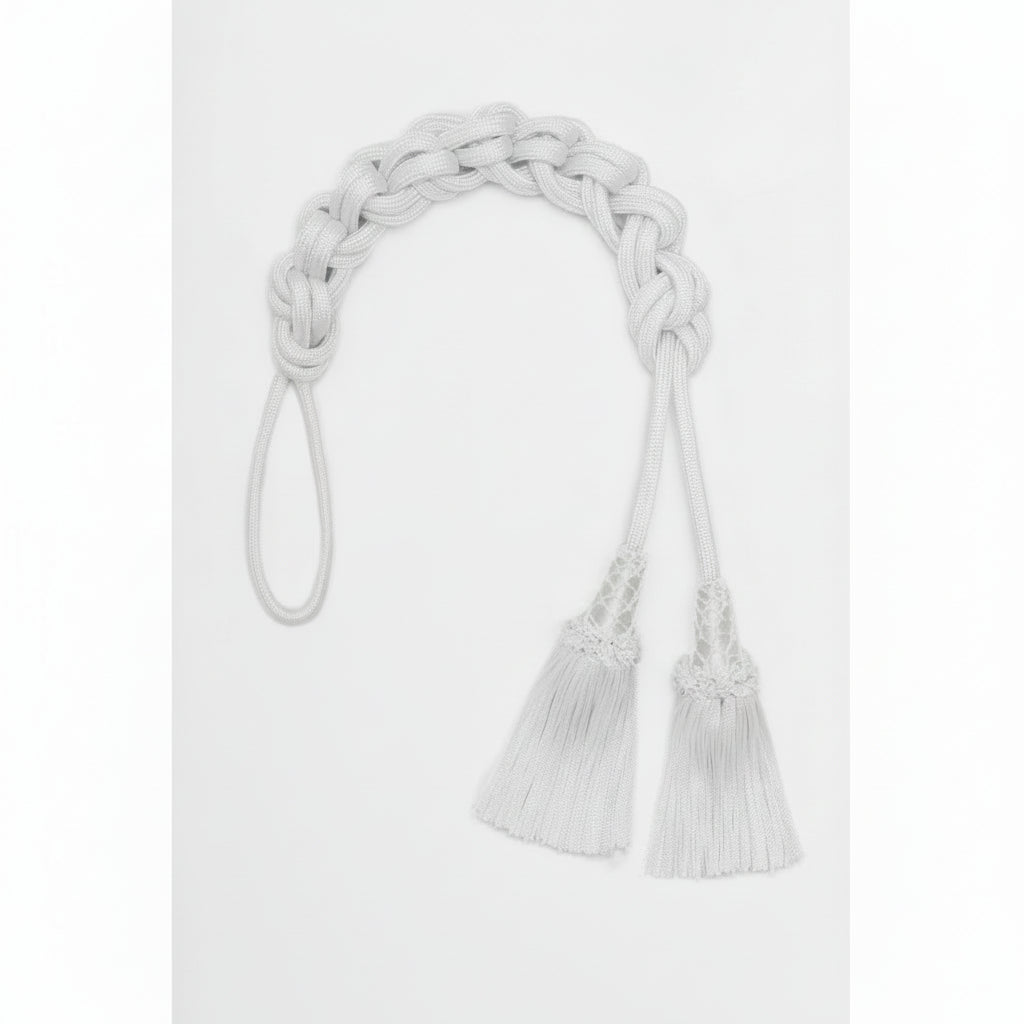 White braided belt with tassels on a white background
