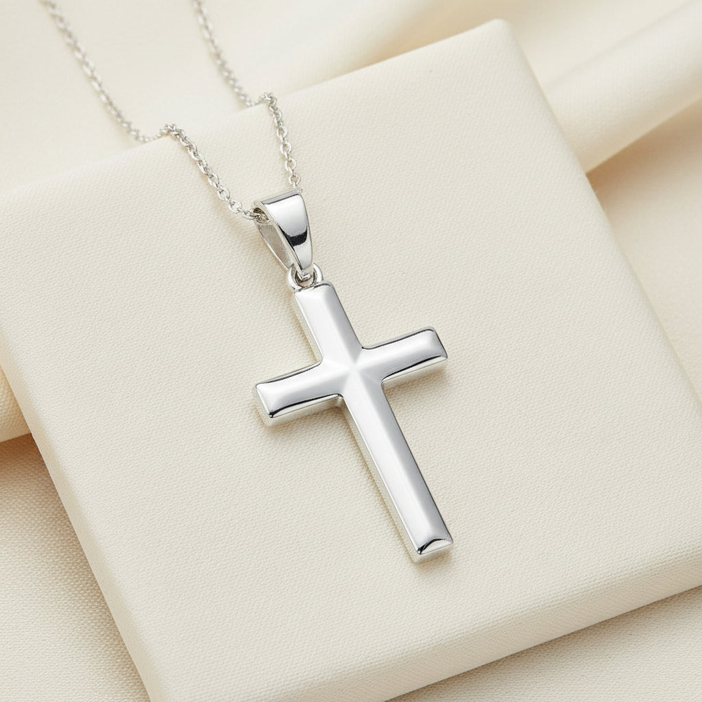 A sterling silver soldered cross necklace with a chain and a lobster clasp closure.