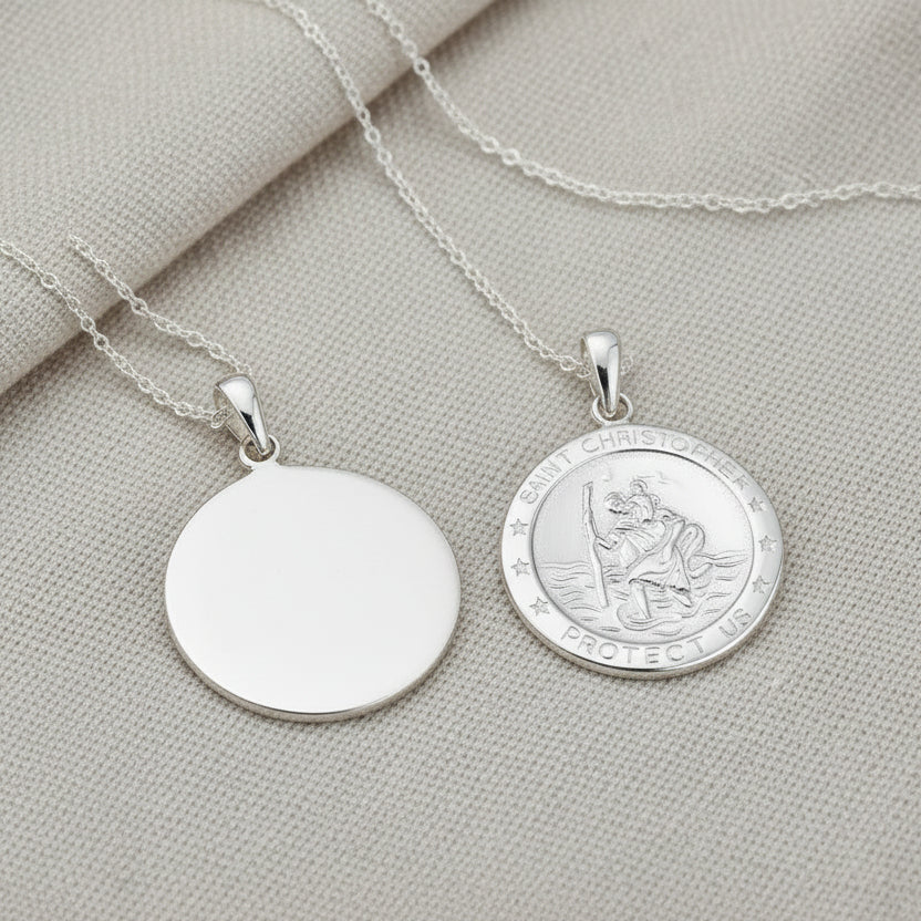 A sterling silver St. Christopher necklace with a round medallion pendant and a chain.